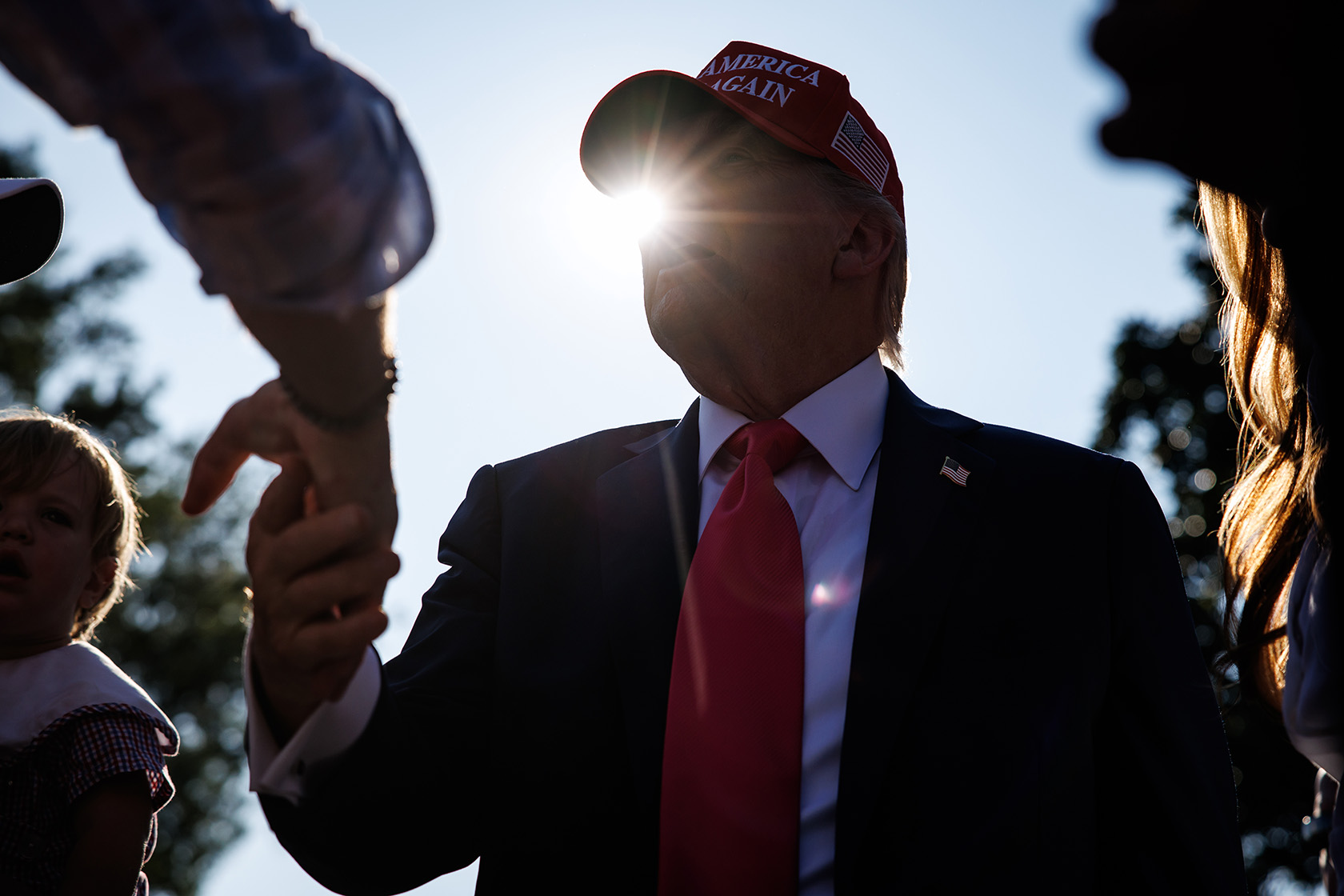 U.S. President Donald Trump greets guests on the South Lawn of the White House