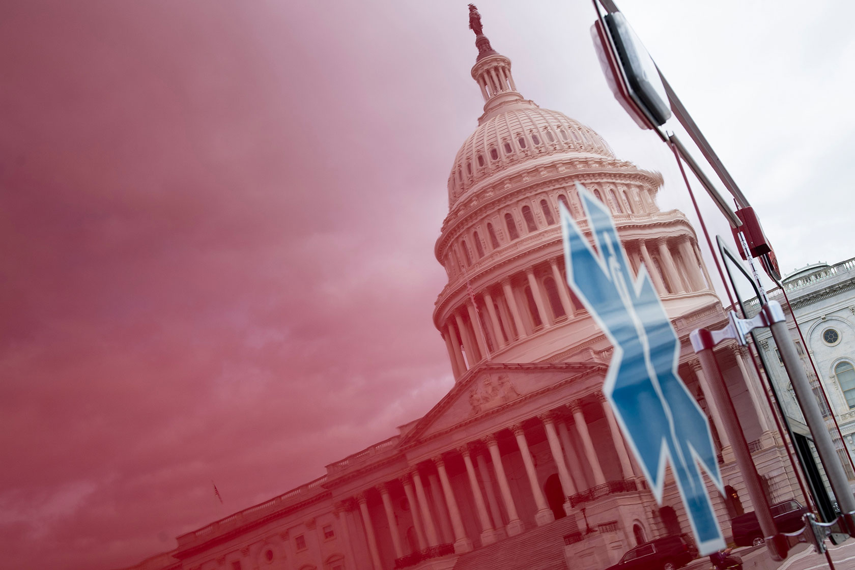 Capitol building reflected in a red ambulance