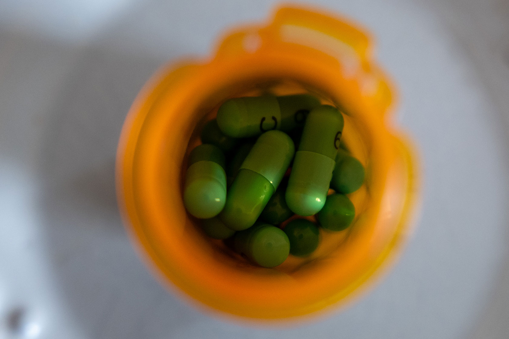 Looking down on pills in a pill bottle