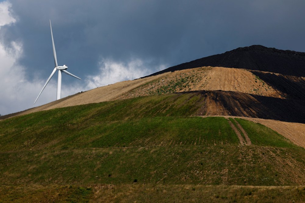 Rock wind farm is seen on Backbone Mountain behind the Mettiki Coal processing plant in Oakland, Maryland.