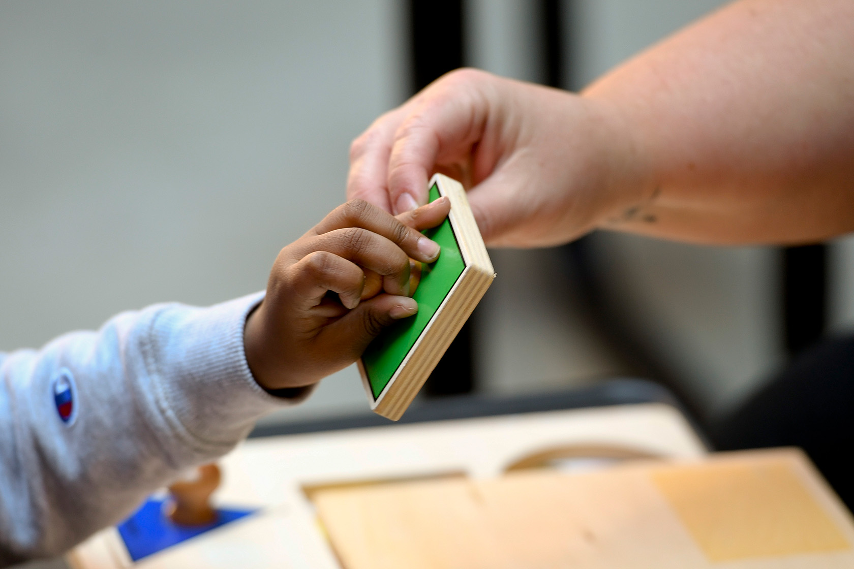 A special education teacher works with her kindergarten student.
