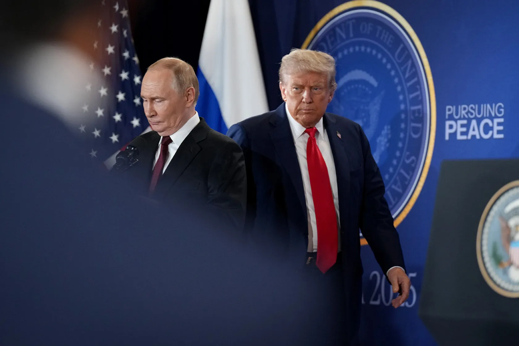 U.S. President Donald Trump and Russian President Vladimir Putin arrive for a press conference.