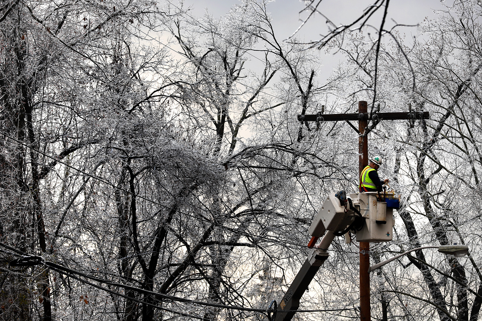 A worker repairs power lines in New Jersey
