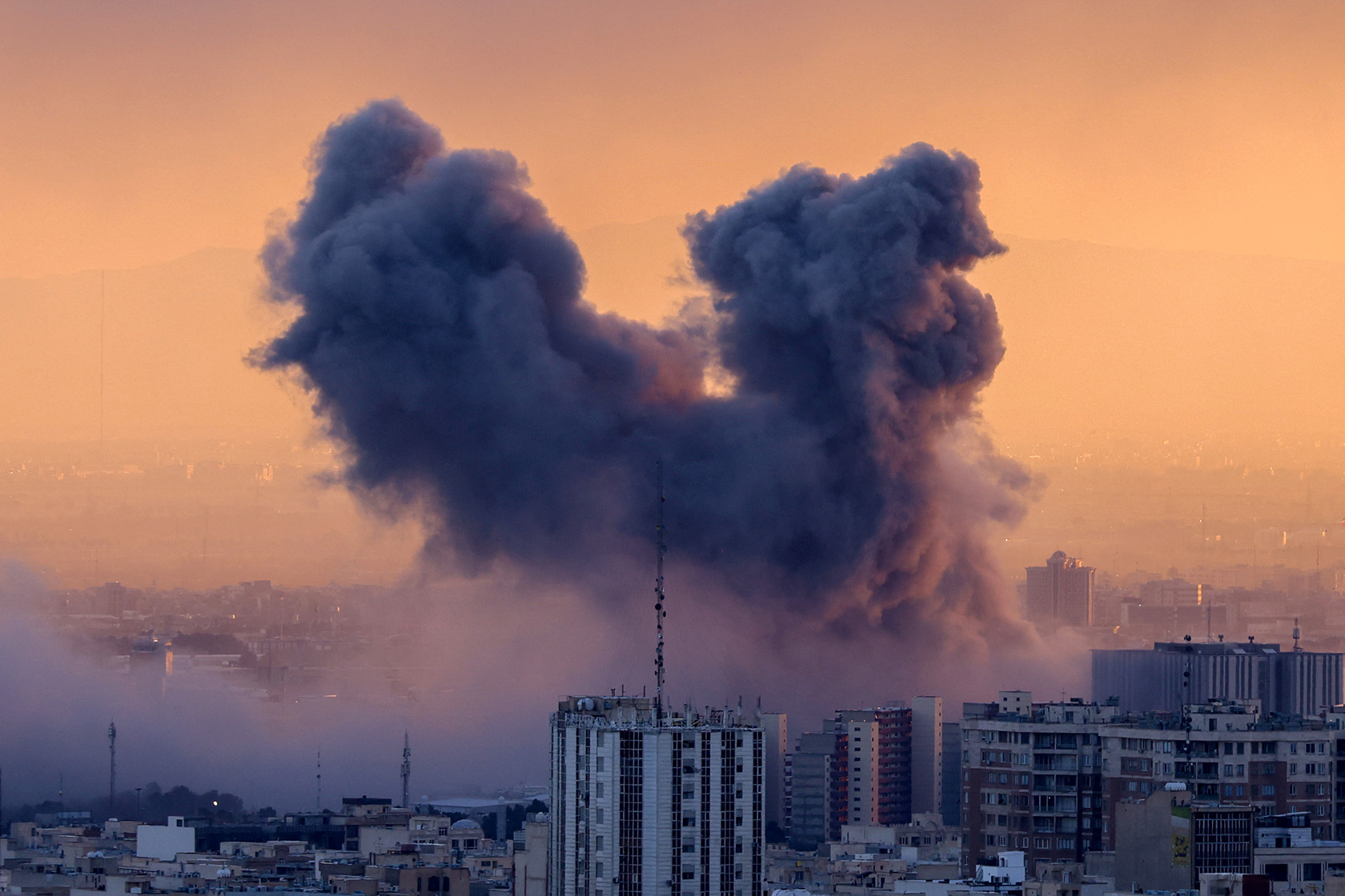 A plume of smoke rises after a strike on the Iranian capital of Tehran.