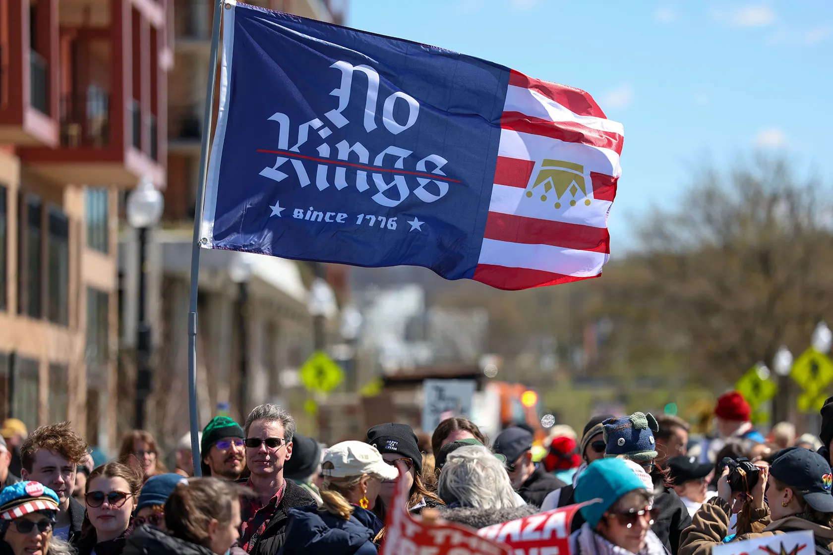 A “No Kings” flag is seen amid protesters in Washington, D.C.