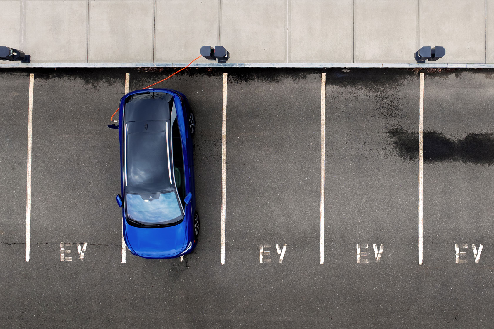 An electric vehicle is seen charging in a parking lot in Storrs, Connecticut, on March 31, 2026.
