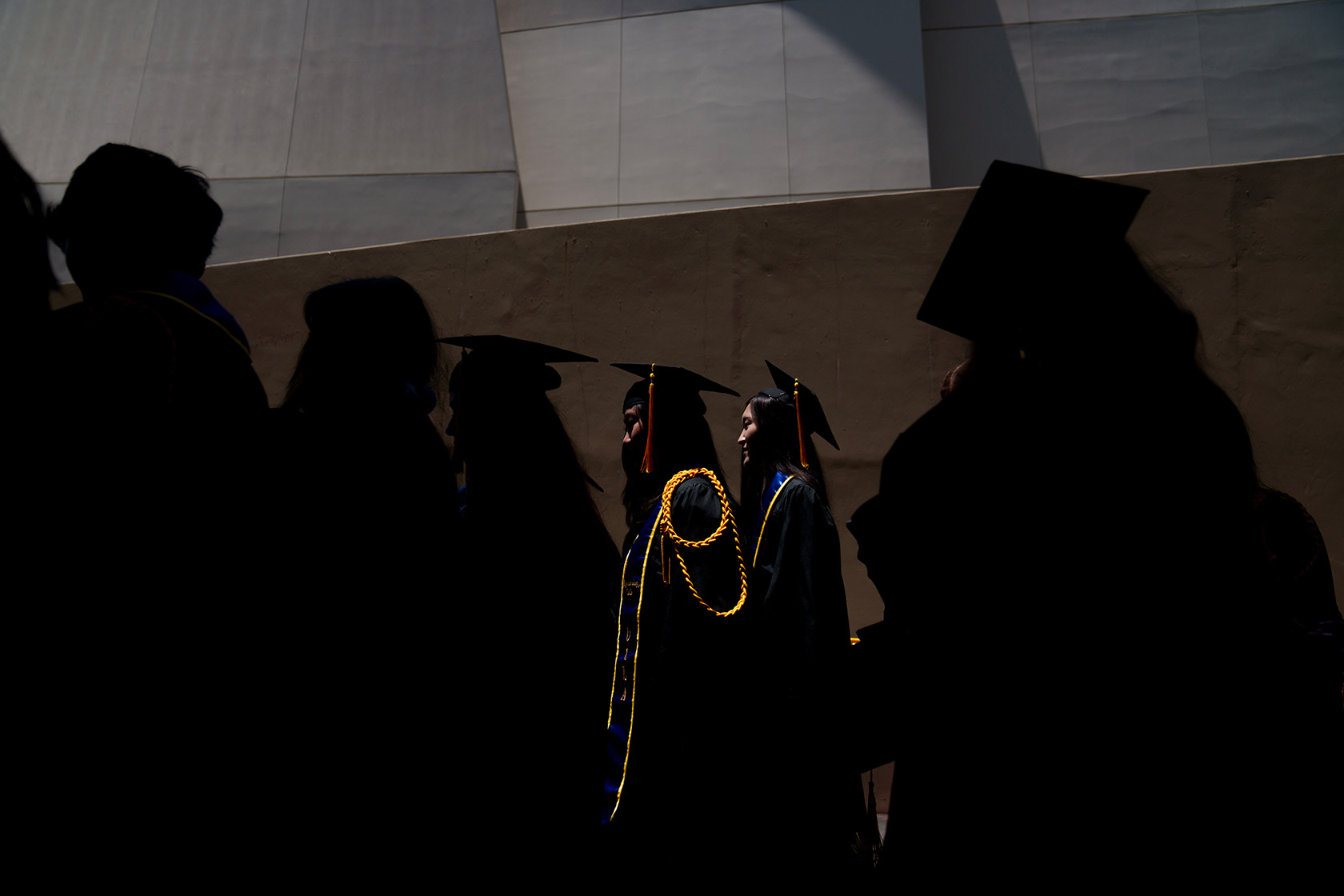 Students exit a graduation ceremony in Los Angeles.