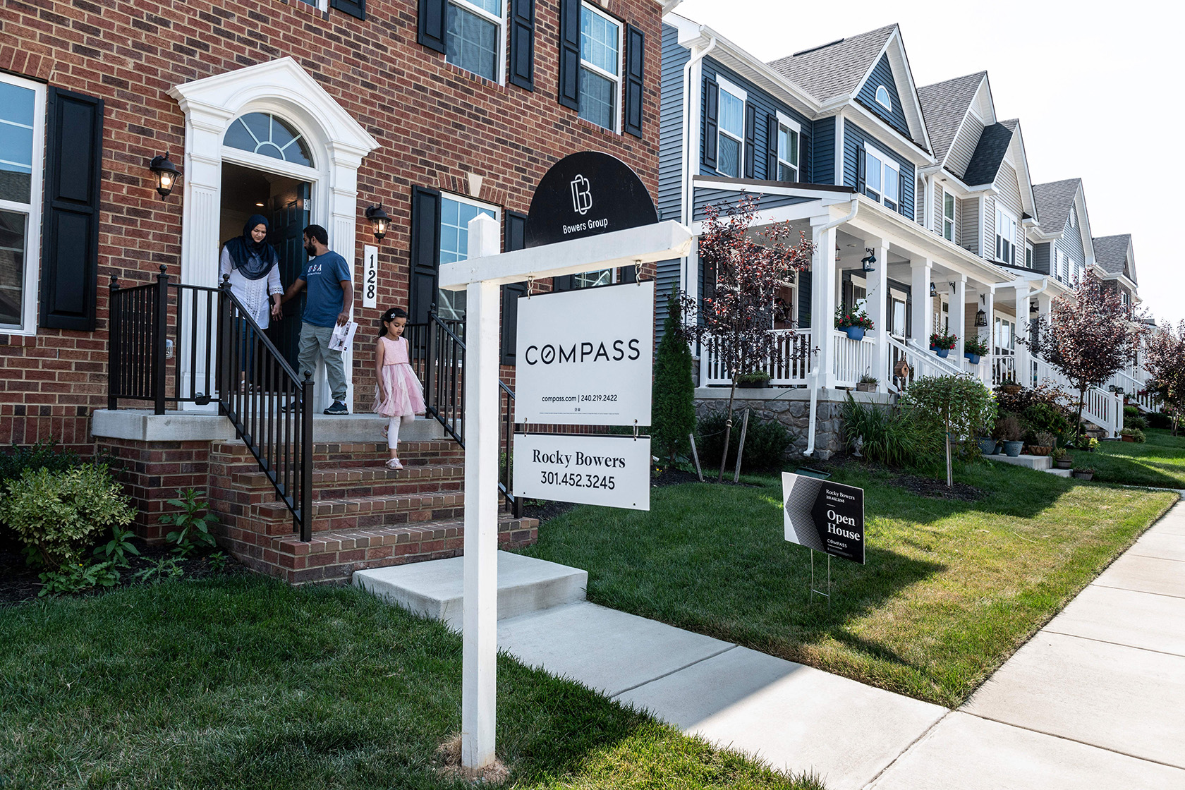 Prospective homebuyers leave a property.