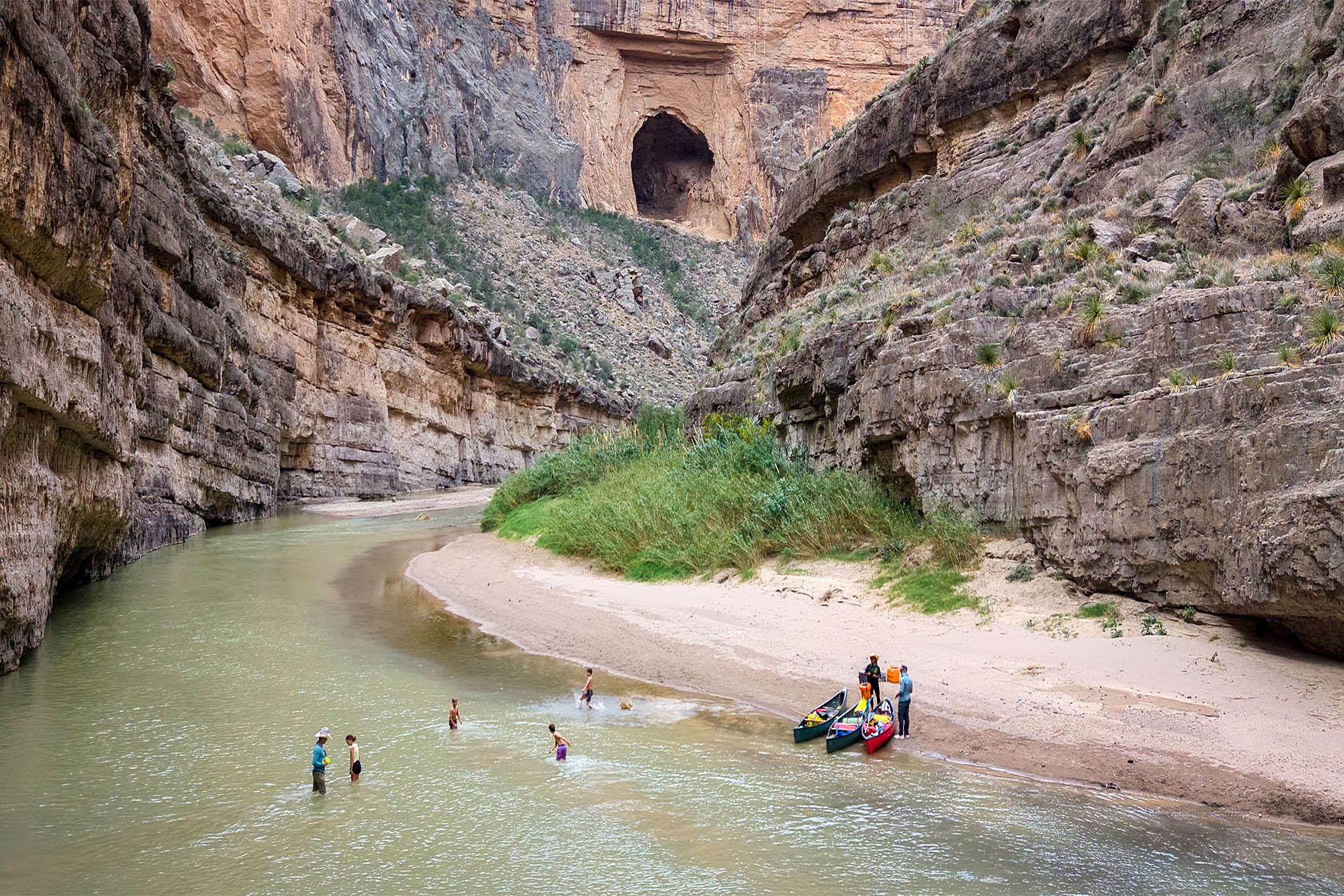 Visitors swim and prepare canoes in the Rio Grande in Big Bend National Park.