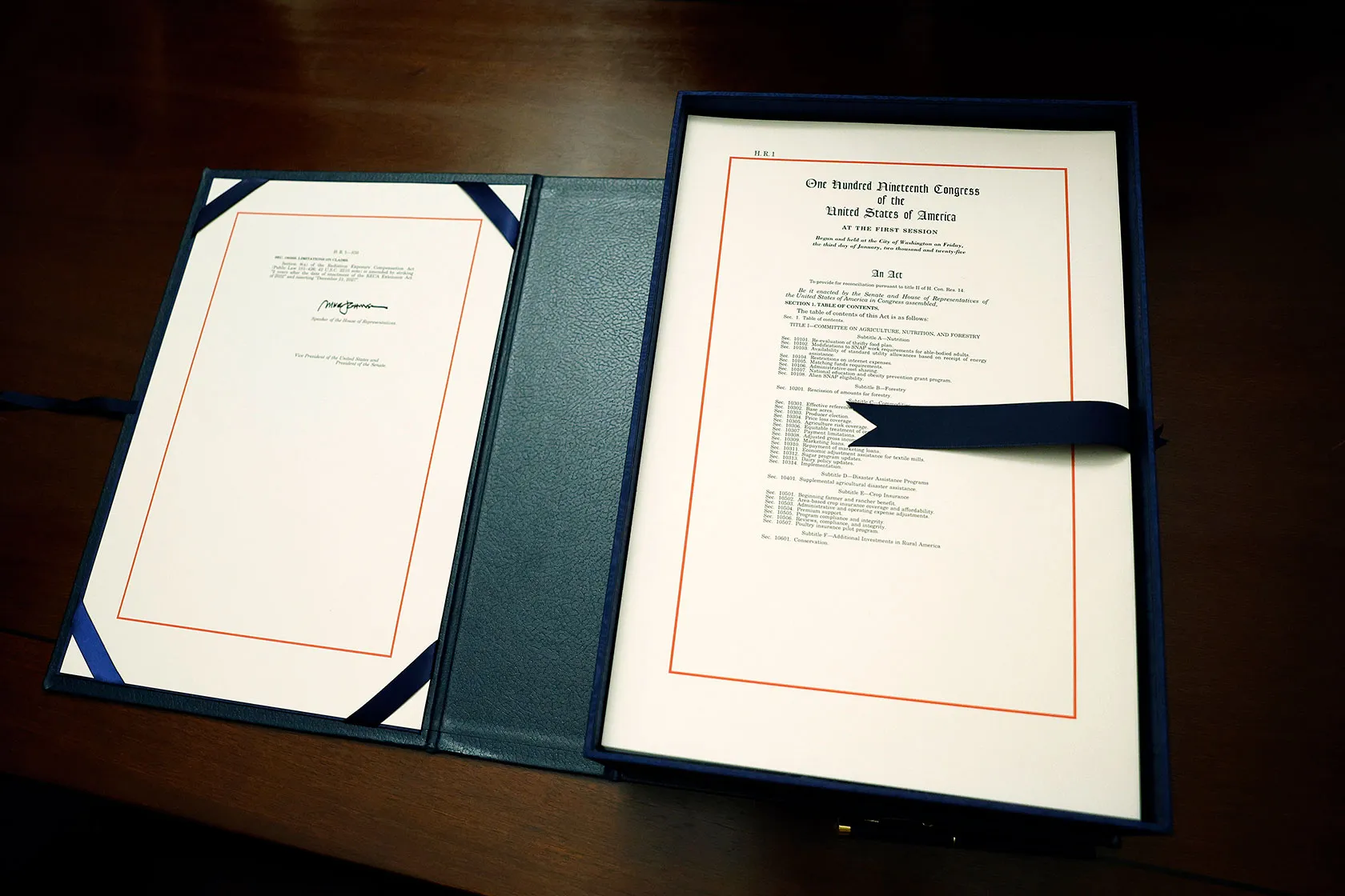 The text of the OBBBA open on a table