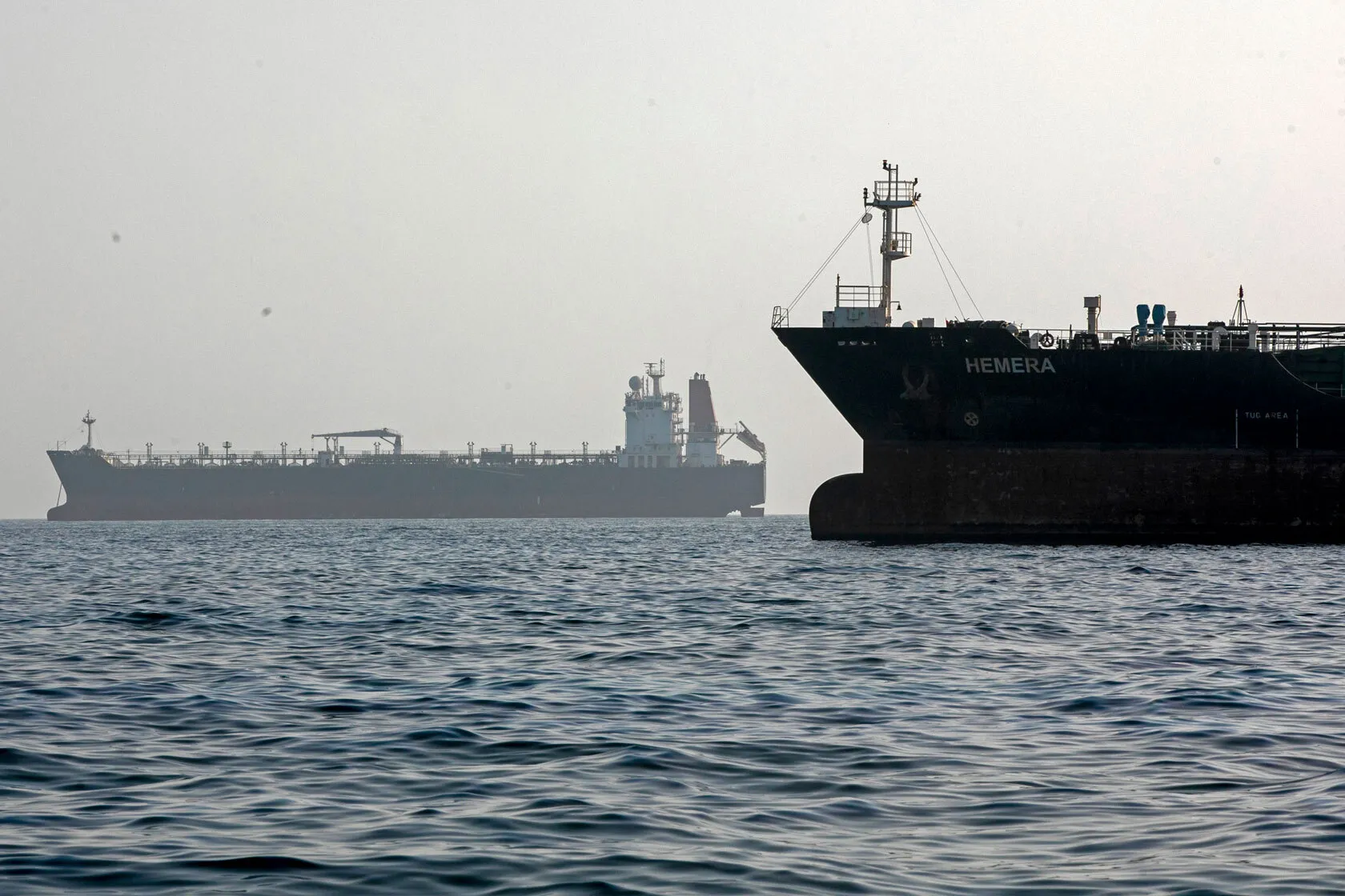 A ship remains anchored on May 16, 2026 in the Strait of Hormuz near Larak Island, Iran.