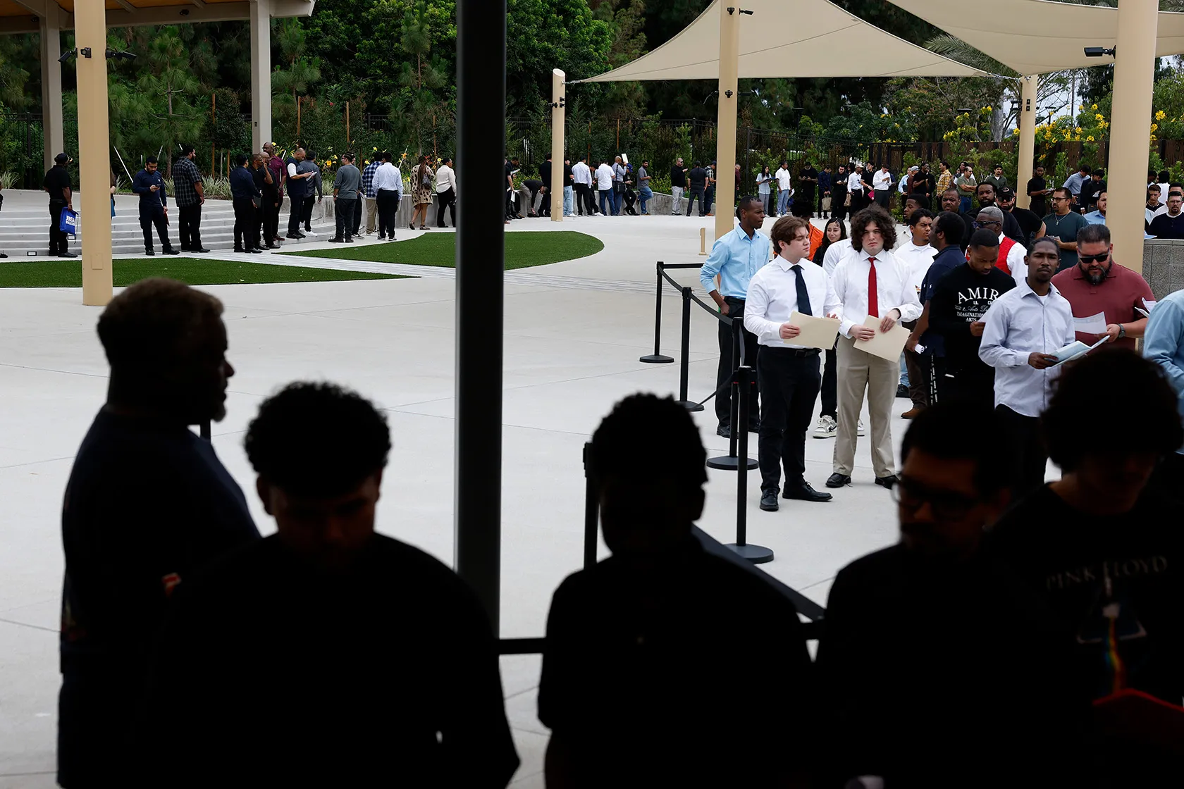 Job seekers wait in line at a job fair in Carson, California.