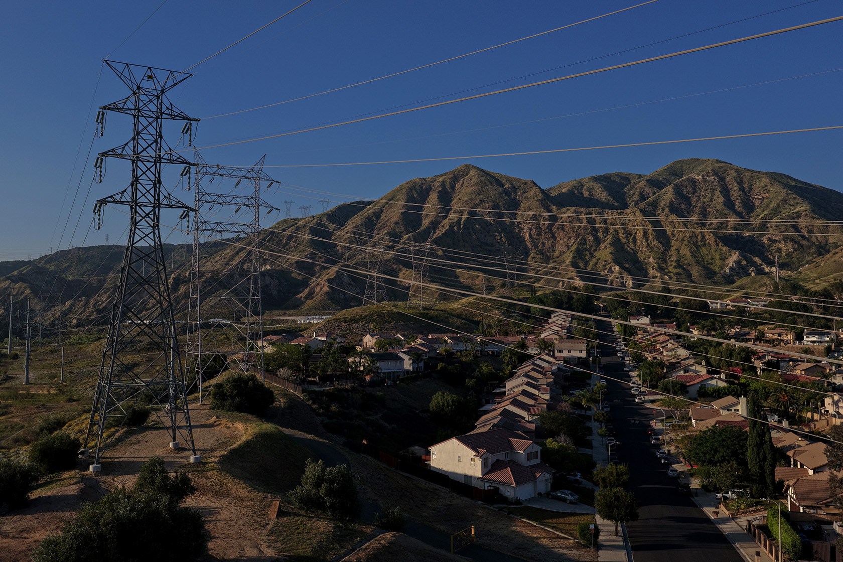 Electrical transmission lines hang over a housing development in Sylmar.