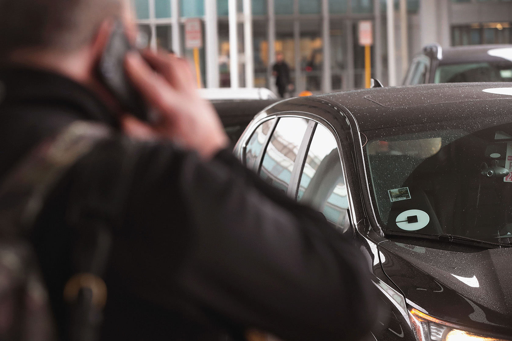 Travelers catch rideshare vehicles at O'Hare International Airport.