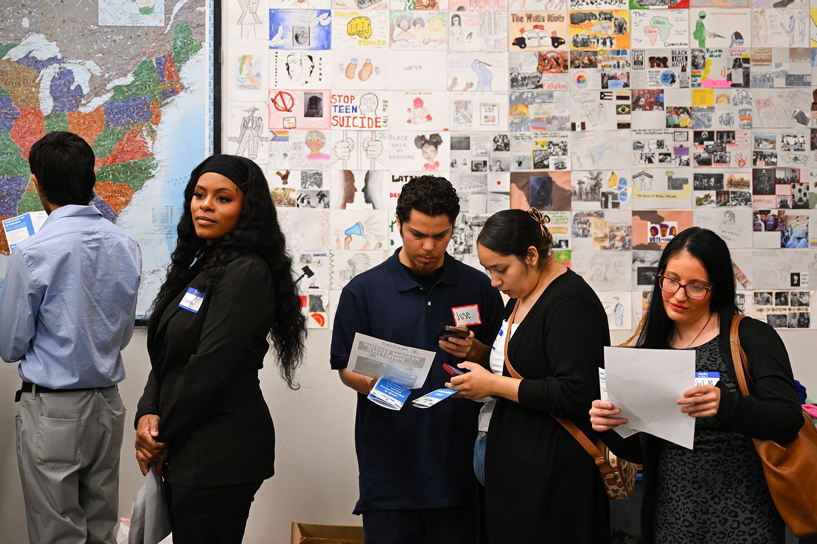 Job seekers wait in line for free resume preparation services.