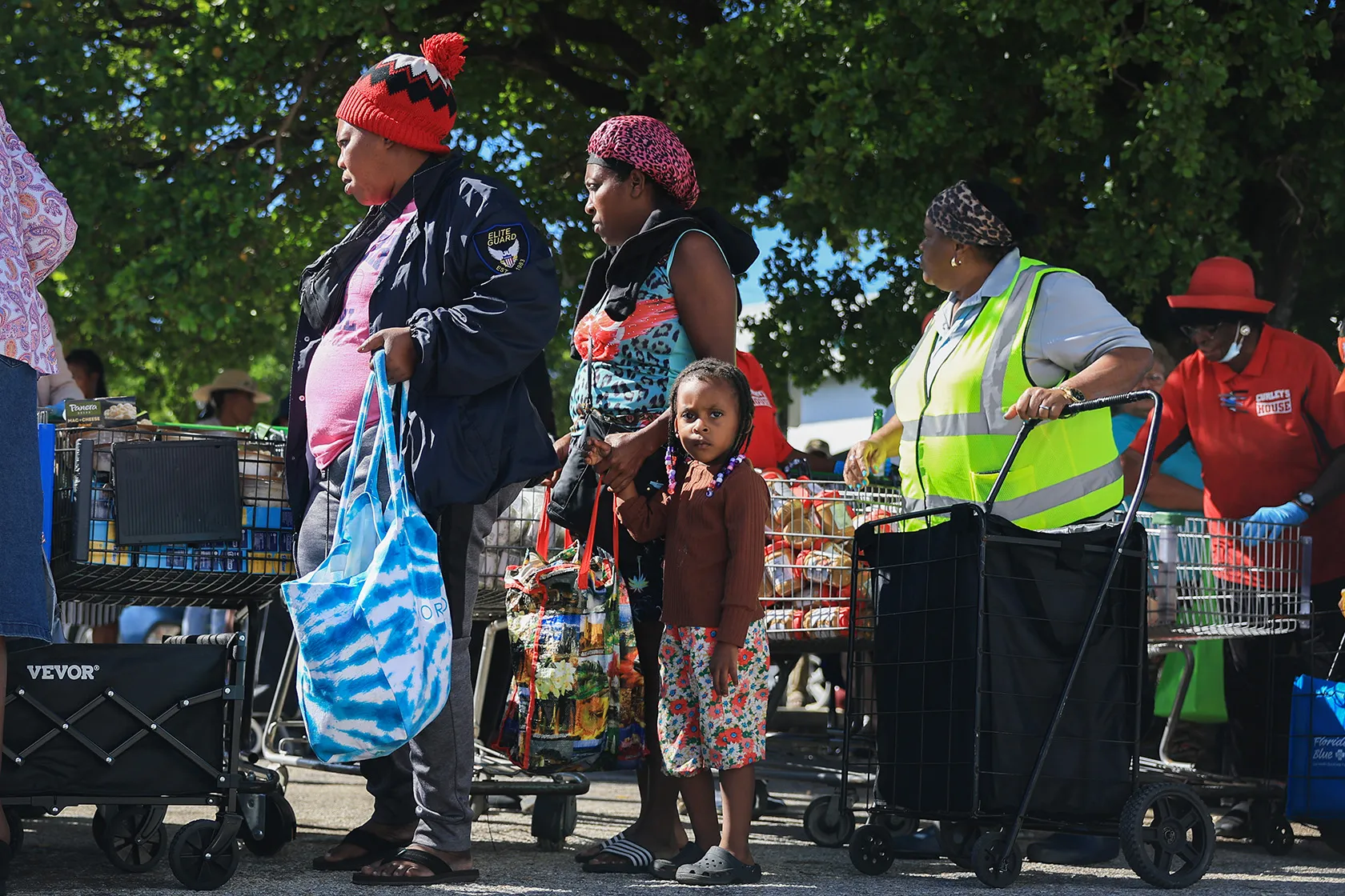 People receive groceries from a food bank in Miami.