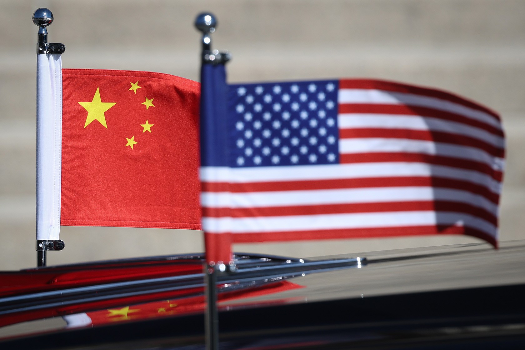 The American and Chinese flags are seen on the motorcade of U.S. President Donald Trump.