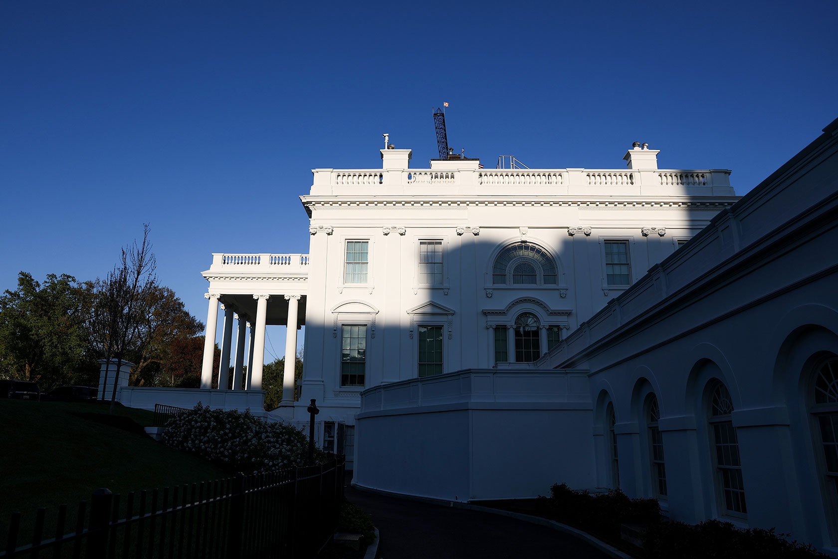 The side of White House in low, shadowed sunlight