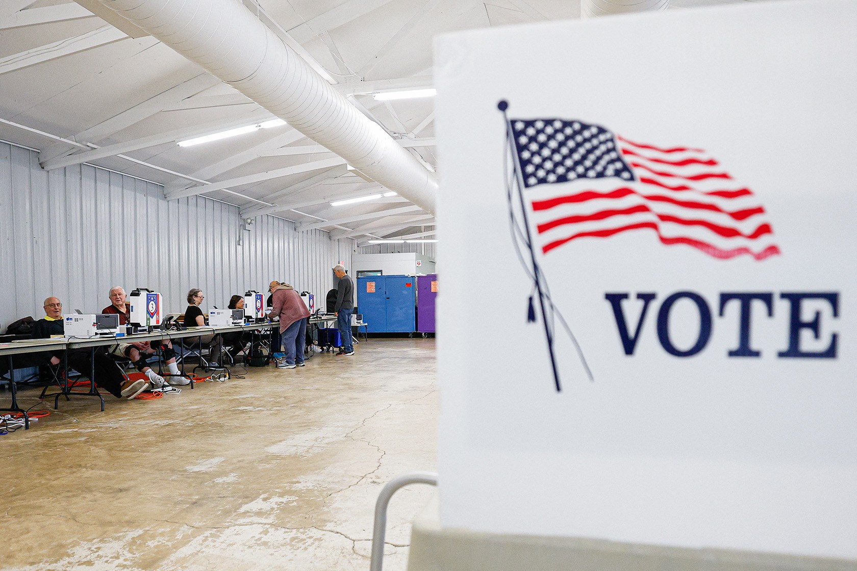 Voters check in on the second day of early voting ahead of the midterm elections