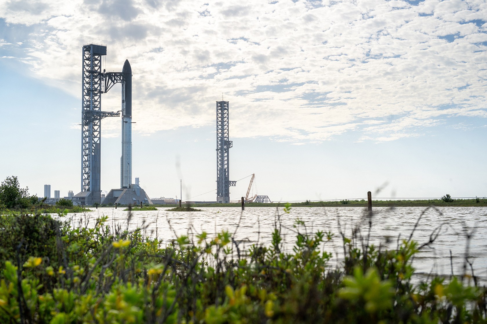 The SpaceX Starship V3 is seen docked at a launchpad.